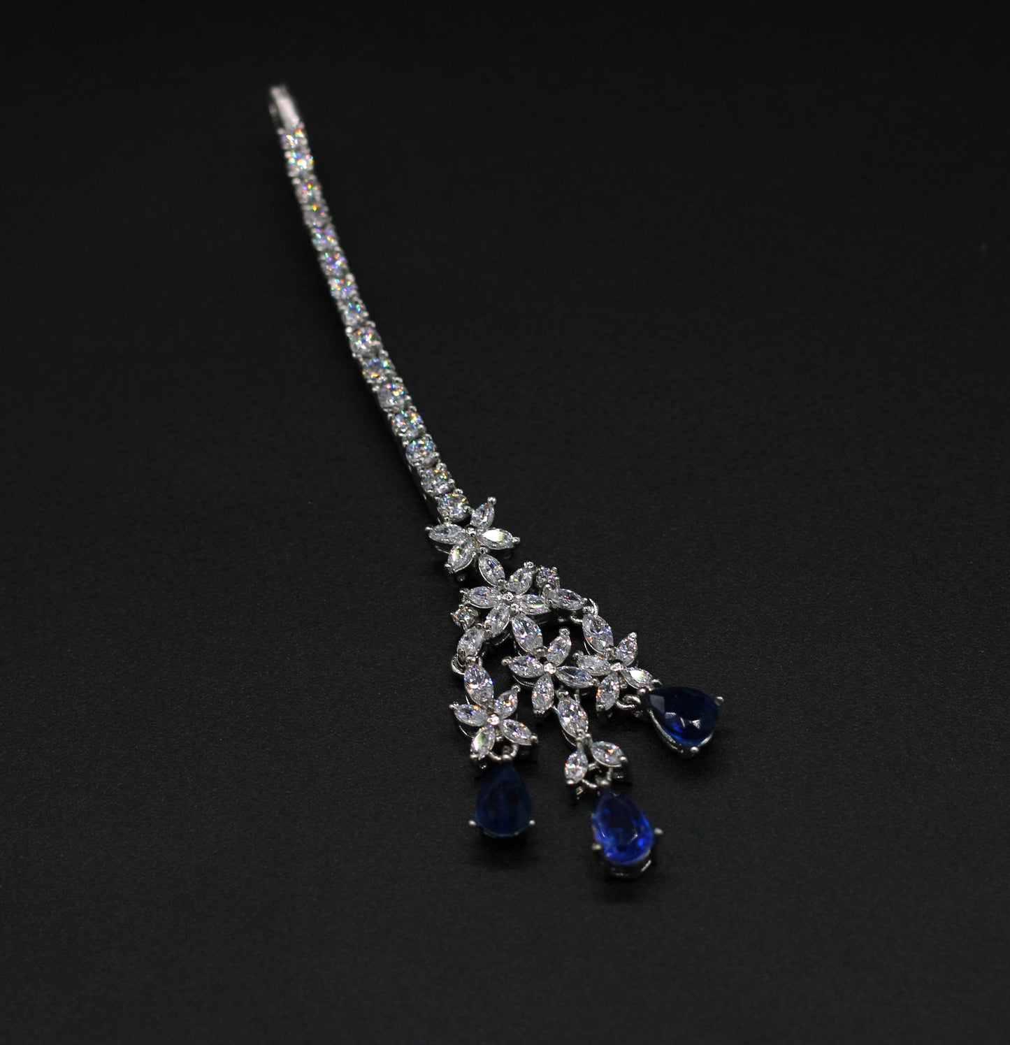 MANGTIKA IN 92.5 STERLING SILVER WITH SWAROVSKI  AND IOLITE COLOR Stoned IN WHITE RHODIUM PLATED