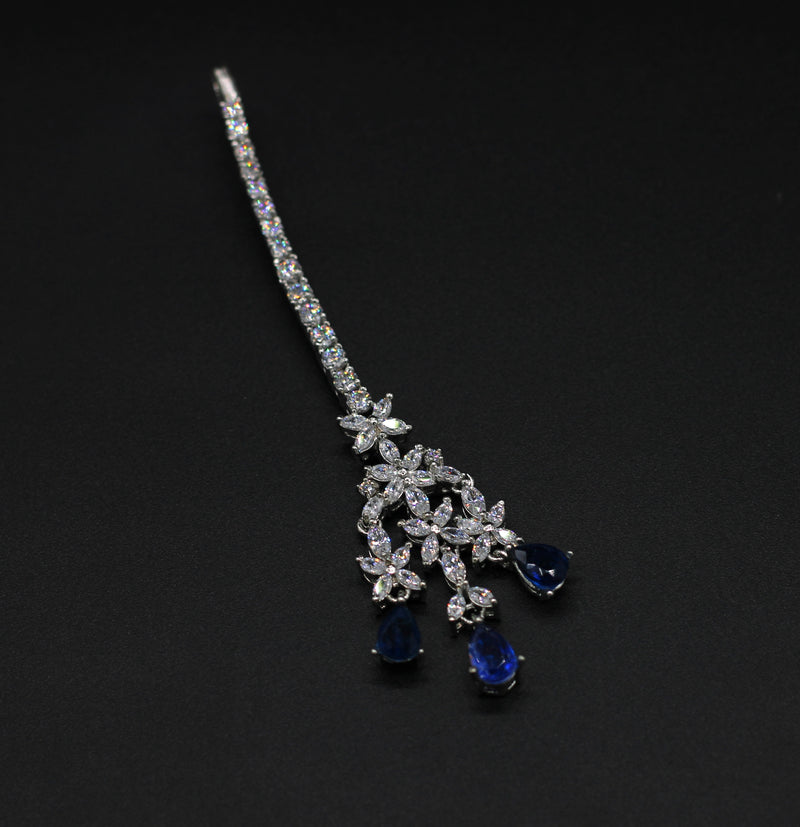 MANGTIKA IN 92.5 STERLING SILVER WITH SWAROVSKI  AND IOLITE COLOR STONE IN WHITE RHODIUM PLATED